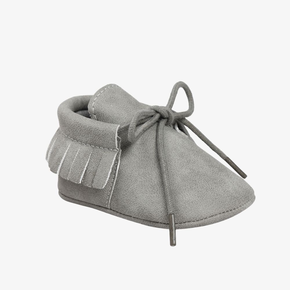 Mocasines con cordones y flecos para bebé