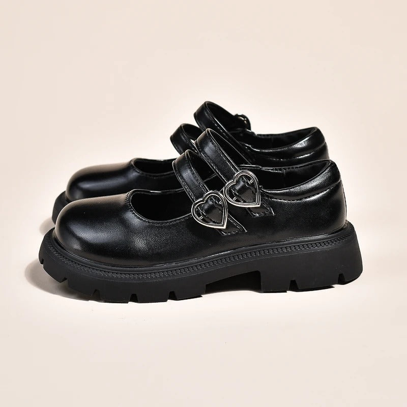 Mocasines negros de moda para niña con doble hebilla