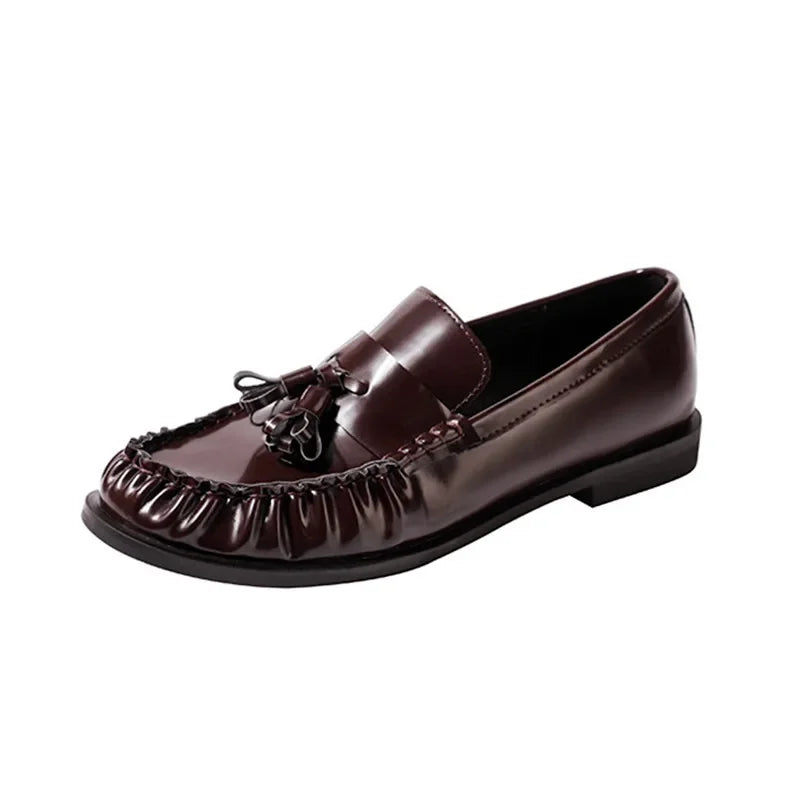 Mocasines con borlas en negro y burdeos